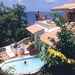 In their own tile-roofed white stucco villas, or in individual rooms, tucked among the trees on a hillside above pretty Labrolette Bay, guests can be as private as they please.